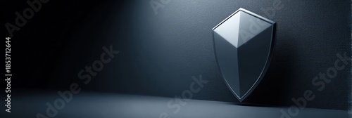 A sleek, modern shield design against a dark background, symbolizing protection and security in a digital era.