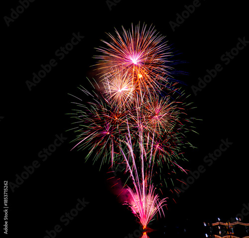 Colorful fireworks exploding in the night sky, symbolizing celebration, festival opening ceremony, New Year celebration, success, joy, and special events.
