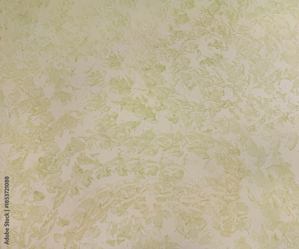 Fototapeta premium Close up of green and beige decorative washed paint, suitable for wall finishes. Seamless background texture.