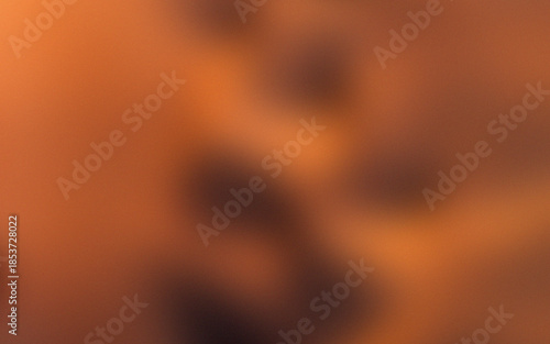 Abstract orange bokeh background with glowing light and warm fiery textures