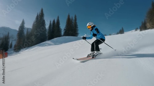 Skier Carving Down a Snowy Mountain Slope on a Sunny Day.