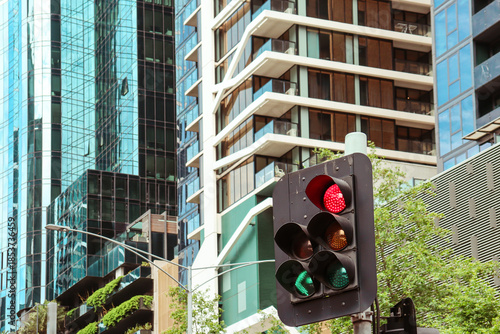 traffic light in the city with skyscrapers