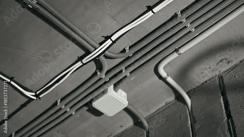 White Plastic Conduits Mounted Under Concrete Ceiling Neat Bends Junction Box Visible Modern Renovation Vibe