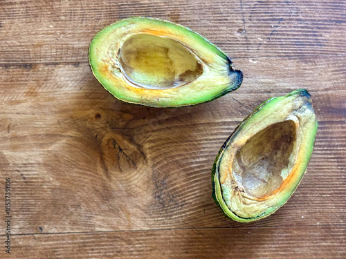 Halved avocado showing signs of spoilage and oxidation