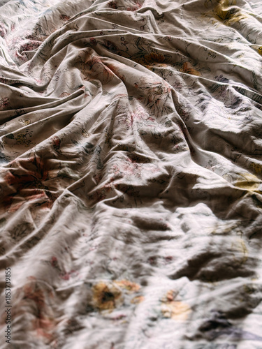 Close up of crumpled bedding texture with floral design