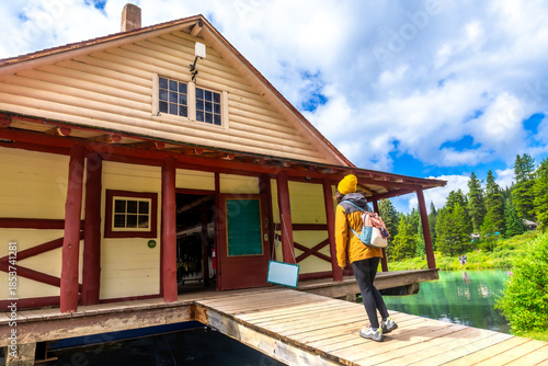 Wallpaper Mural Tourist admiring maligne lake from boathouse in jasper national park Torontodigital.ca