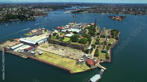 An Aerial Perspective Of Historic Island Shipyard With Industrial Structures And Restoration Efforts