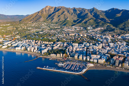 Luxury Living at Dawn: Cinematic 4K Aerial of Marbella’s Golden Mile, Featuring Exclusive Beachfront Resorts, the Paseo Marítimo, and La Concha Mountain, Costa del Sol, Spain