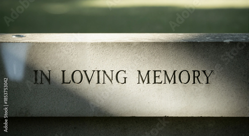 Engraved stone memorial with inscriptions in loving memory  