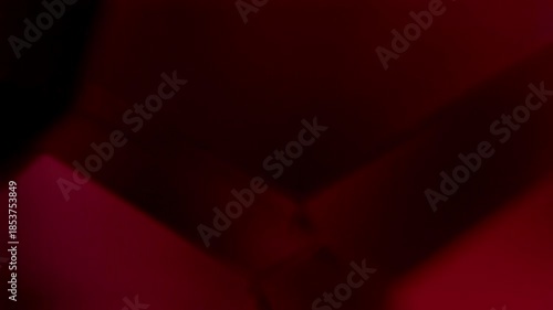 Red Geometric Forms Seamless Loop. Minimalist blurred crimson and burgundy abstract planes slowly shifting in elegant low-key rotation.