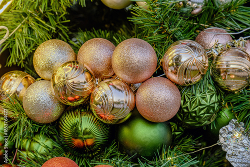 christmas tree decoration with many colorful shiny winkle balls in the garden