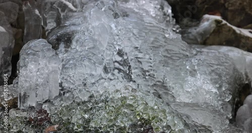 Wallpaper Mural Icy cascade formation, glistening in the ambient light, showcasing the artistry of nature with its frozen beauty.  A dance of water turned to shimmering ice. Torontodigital.ca