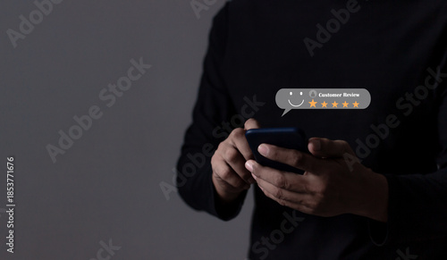 Review Customer, Young Man hand using smartphone mobile with five star to review and give 5 stars with very good results in service, Good review 5 star rating choice feedback
