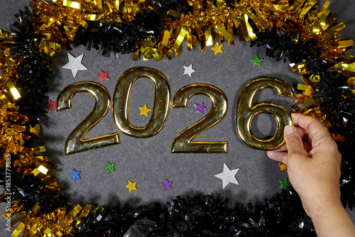 Golden 2026 Numerals With Confetti and Tinsel Create Festive New Year Display