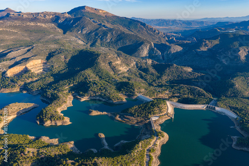 Cinematic Aerial 4K: Sweeping Wide-Angle Sunset Over Guadalhorce Lake, Pine Forests, and the Dramatic Caminito del Rey Gorge in Andalusia