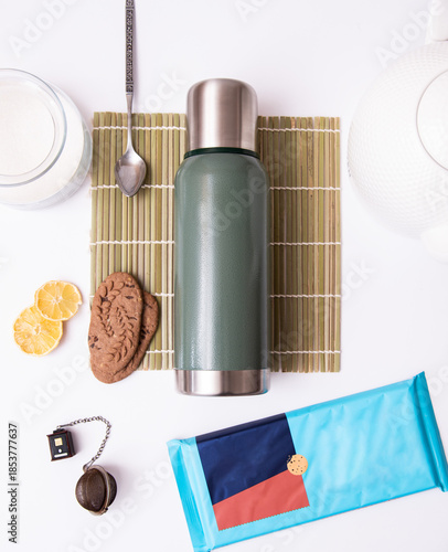 Wallpaper Mural Reusable tea thermos flat lay with loose tea accessories on white background, sustainable daily drinkware Torontodigital.ca
