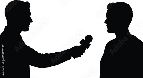 Silhouette of two men in conversation one holding a microphone
