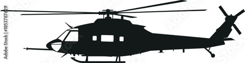 Silhouette of a military helicopter in flight against a neutral background