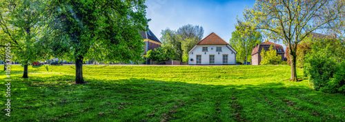 Panorama of a houses along Raadhuisdijk in Maasbommel, Netherlands
