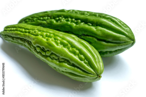 bitter melon, also known as bitter gourd or Momordica charantia isolated on white background 
