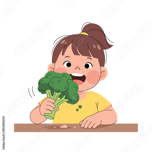 Young girl happily eating broccoli while sitting at a table  