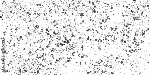 Dark gray paint splatters on a deep black surface create an abstract distressed texture, perfect for background graphics, overlay effects, or contemporary design elements.