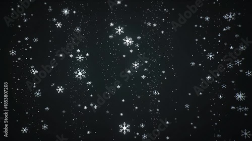 Snowflakes falling on dark background in winter scene  