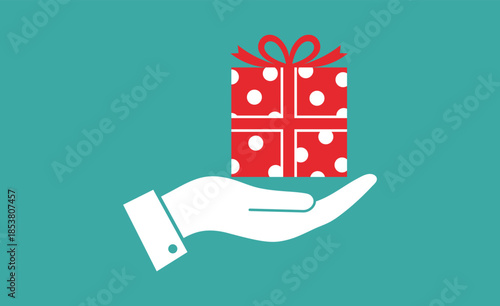White hand holding a red polka dot gift box with a red ribbon present