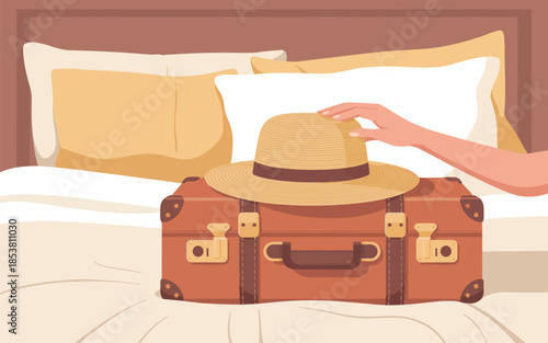 A person is preparing for travel with a vintage suitcase and hat on a bed