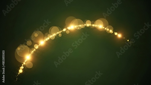 Golden light particles forming an arc on dark green background