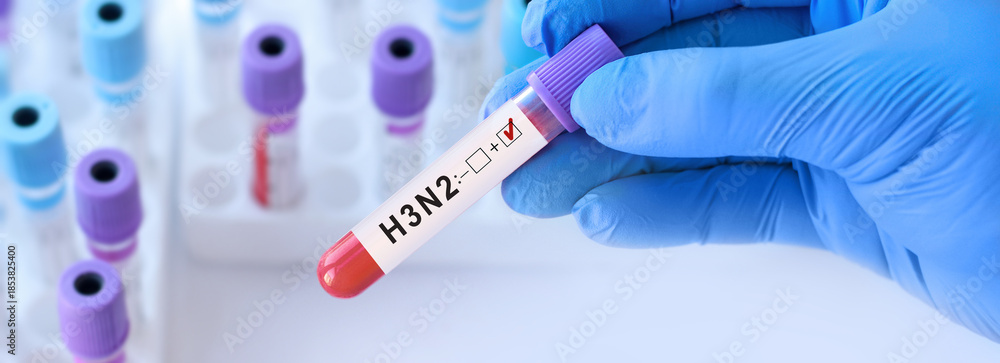 Naklejka premium Doctor holding blood sample tube labeled H3N2 influenza a virus test, laboratory diagnostics concept highlighting seasonal epidemic risk, vaccination importance and early antiviral treatment