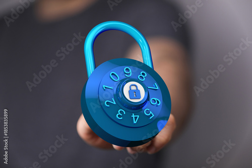 Close up shot of a person holding a blue padlock. Concept of data protection, safety, and security measures. Su © vegefox.com