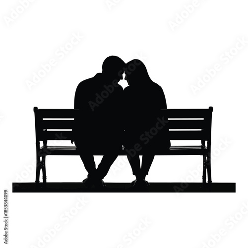 A silhouette of a couple embracing on a park bench at dusk