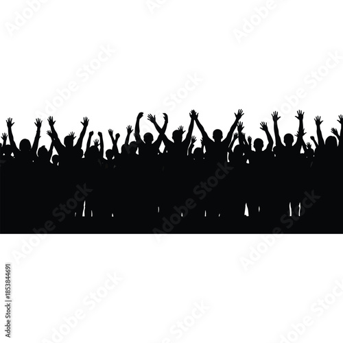 A large crowd of silhouetted people with arms raised in celebration
