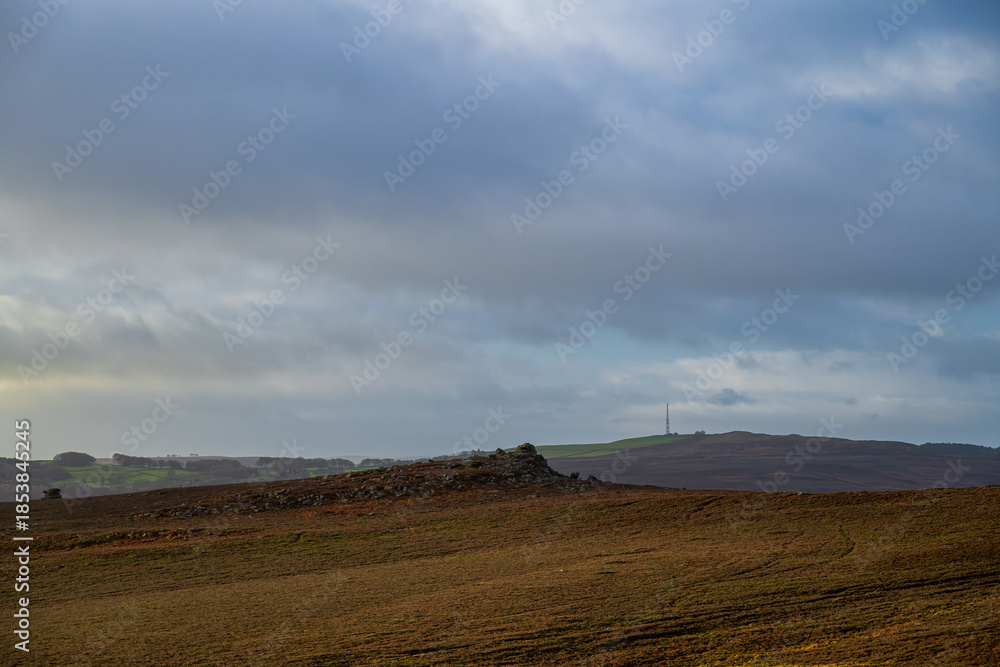 Fototapeta premium A winter sunrise view of Mother Cap and Millstone Edge in the South Yorkshire Peak District National Park, England. UK.