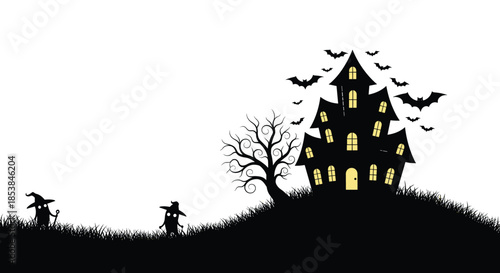 Spooky black silhouette of a haunted mansion sits on a grassy hill surrounded by bats and gnarled trees for a classic halloween scene.