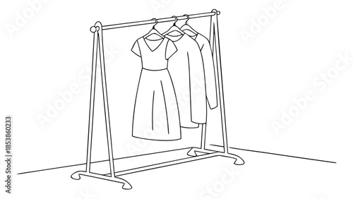 Elegant clothing rack with stylish dresses on hangers