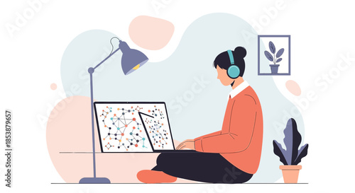 Creative professional at home with laptop and headphones exploring data connections visuals