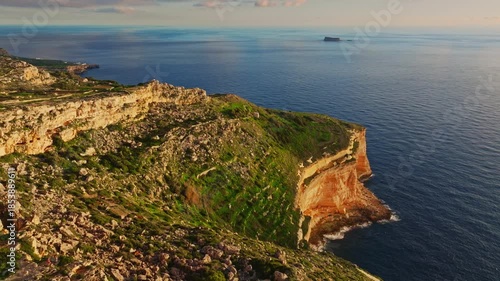 Drone view of countryside, rocks, hills. Dingli cliffs, Filfla island, sunset spot. Mediterranean sea, Maltese island