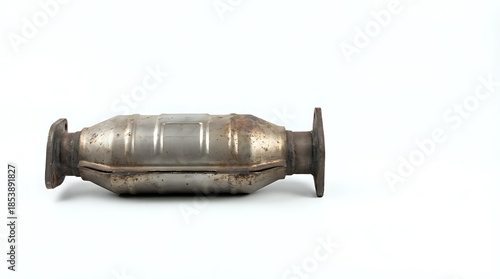 Used metallic automotive catalytic converter isolated on a clean white background studio shot