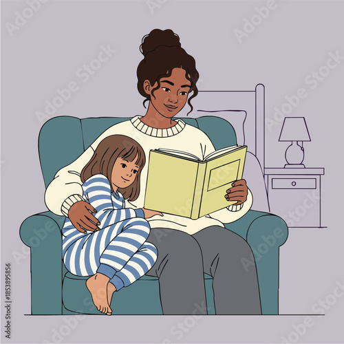 Woman reads a book to a young girl sitting on her lap in a cozy armchair.
