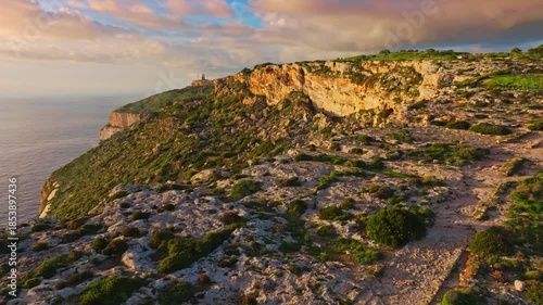 Drone view of countryside, rocks, hills. Famous Dingli cliffs, sunset spot. Mediterranean sea, Malta island