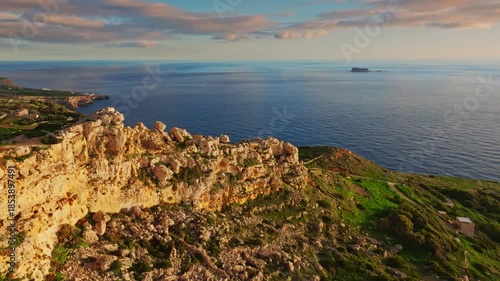 Drone view of countryside, rocks, hills. Dingli cliffs, sunset spot. Mediterranean sea, Malta