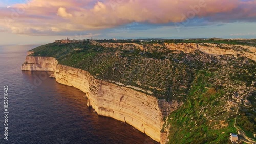 Drone view of countryside, rocks, hills. Dingli cliffs, sunset spot. Mediterranean sea, Maltese island