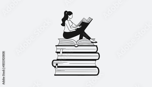 Woman sitting on stack of books reading a book