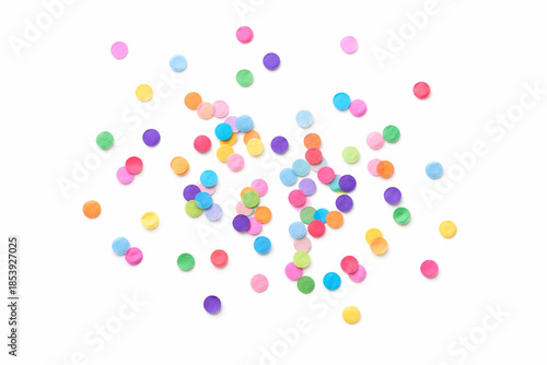 Colorful round confetti scattered on white background