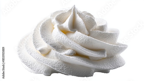 Close-up of a swirl of fresh whipped cream on a white background