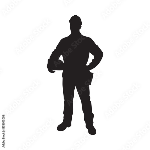 Silhouette of a construction worker standing with hands on hips