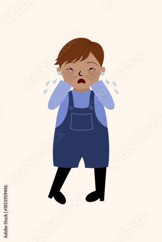 Little boy crying with hands over eyes.