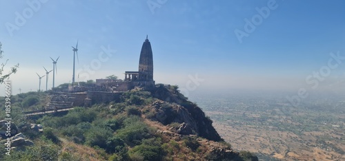 Scenic View of Harsh Parvat Temple and Wind Turbines in Aravalli Range, Rajasthan, India 